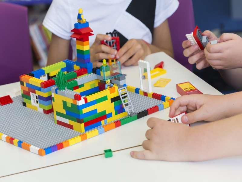 children building a lego town