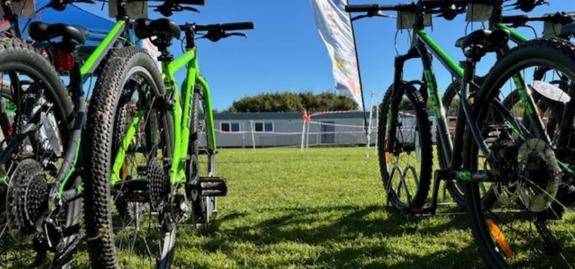 A row of bikes on a school playing field