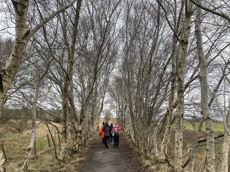 A group of people walking along the Formartine and Buchan Way