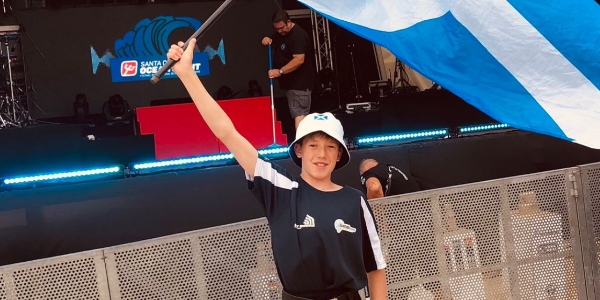 Gabriel Noble waving a Scotland flag