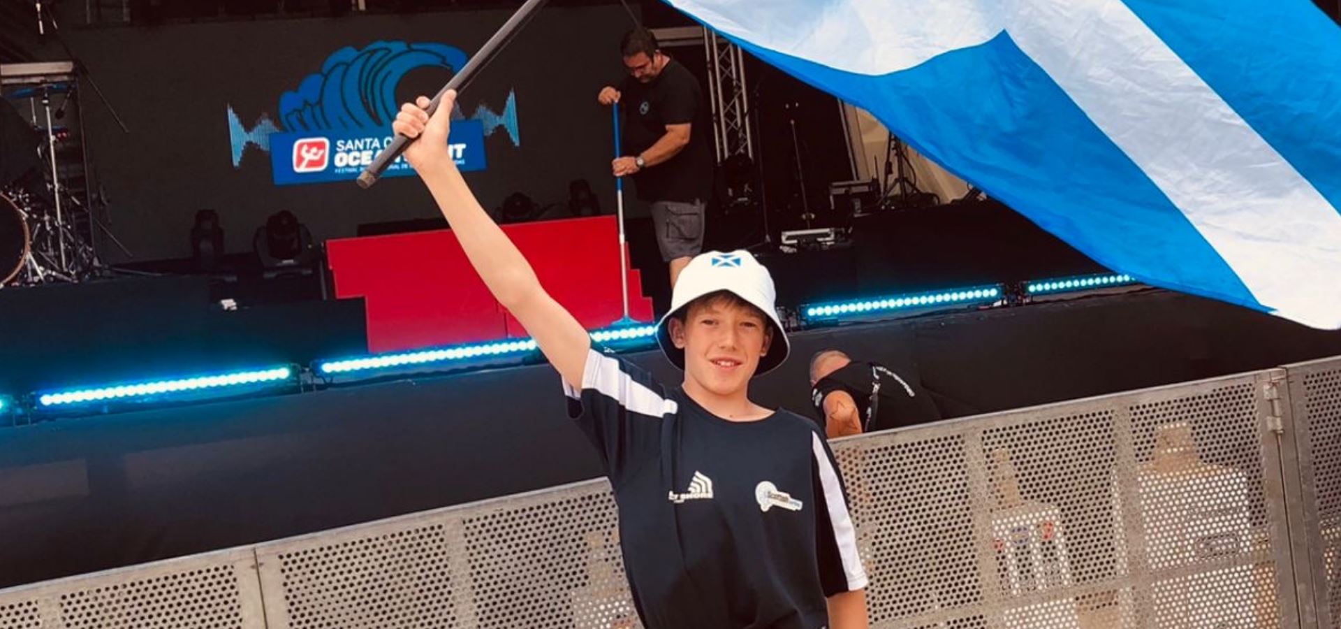 Gabriel Noble waving a Scotland flag