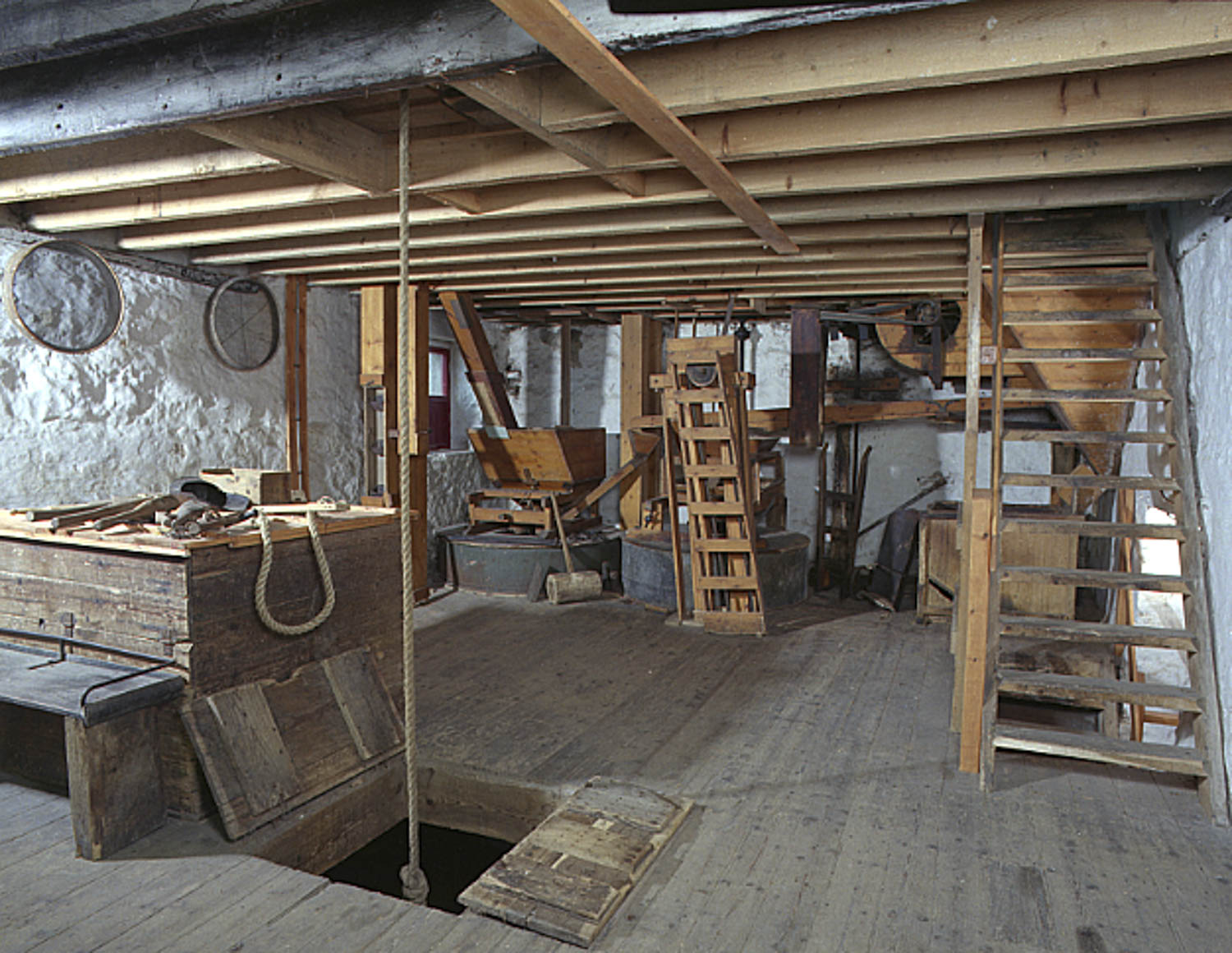 Indoor scene of Meal Mill showing mill workings