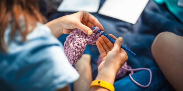 A close up of a person crocheting