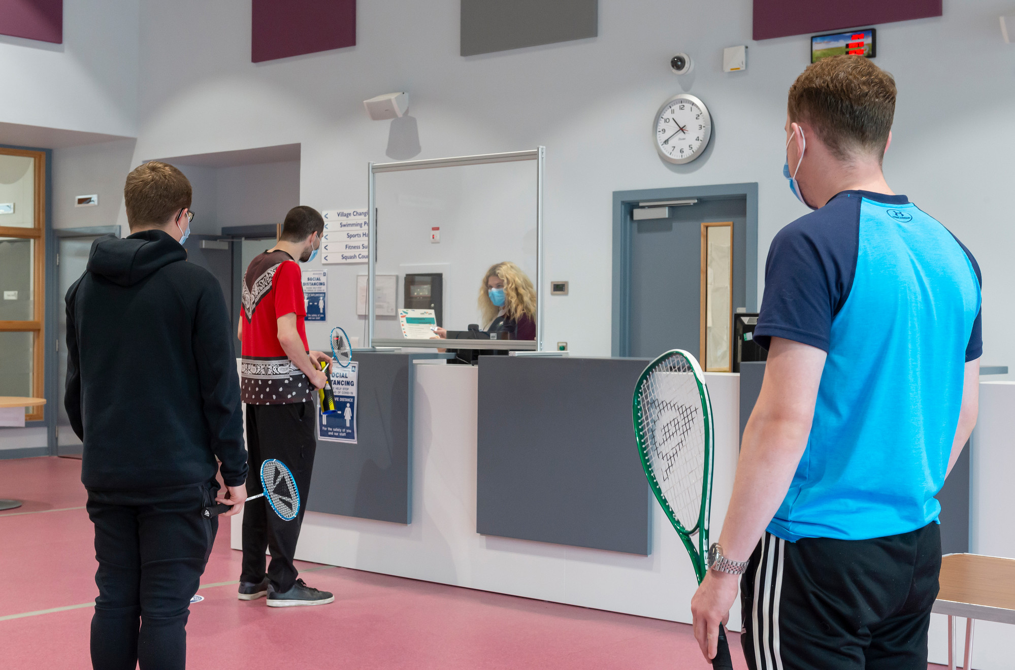 Customers are pictured queuing in a socially-distanced way in an Aberdeenshire sports facility.