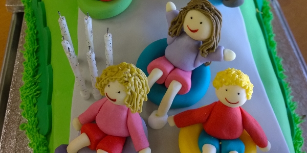A birthday cake with different characters tubing