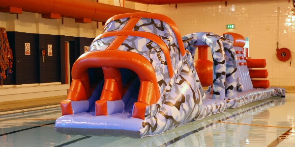 One of Live Life Aberdeenshires inflatable aquaruns set up in the swimming pool